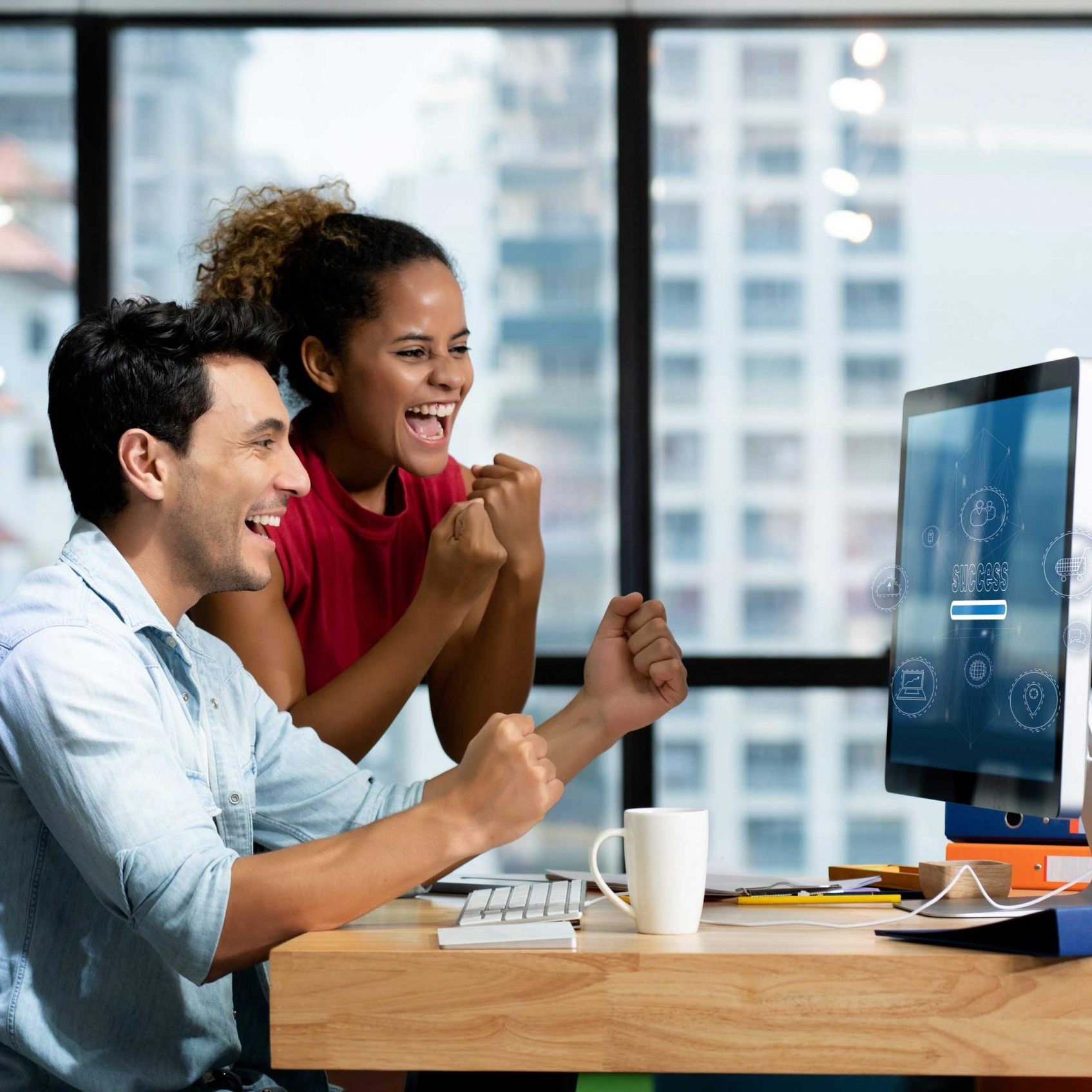 New-generation-sales-force-feeling-happy-in-front-of-computer-in-office