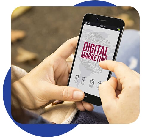 Woman holding a phone with digital marketing
