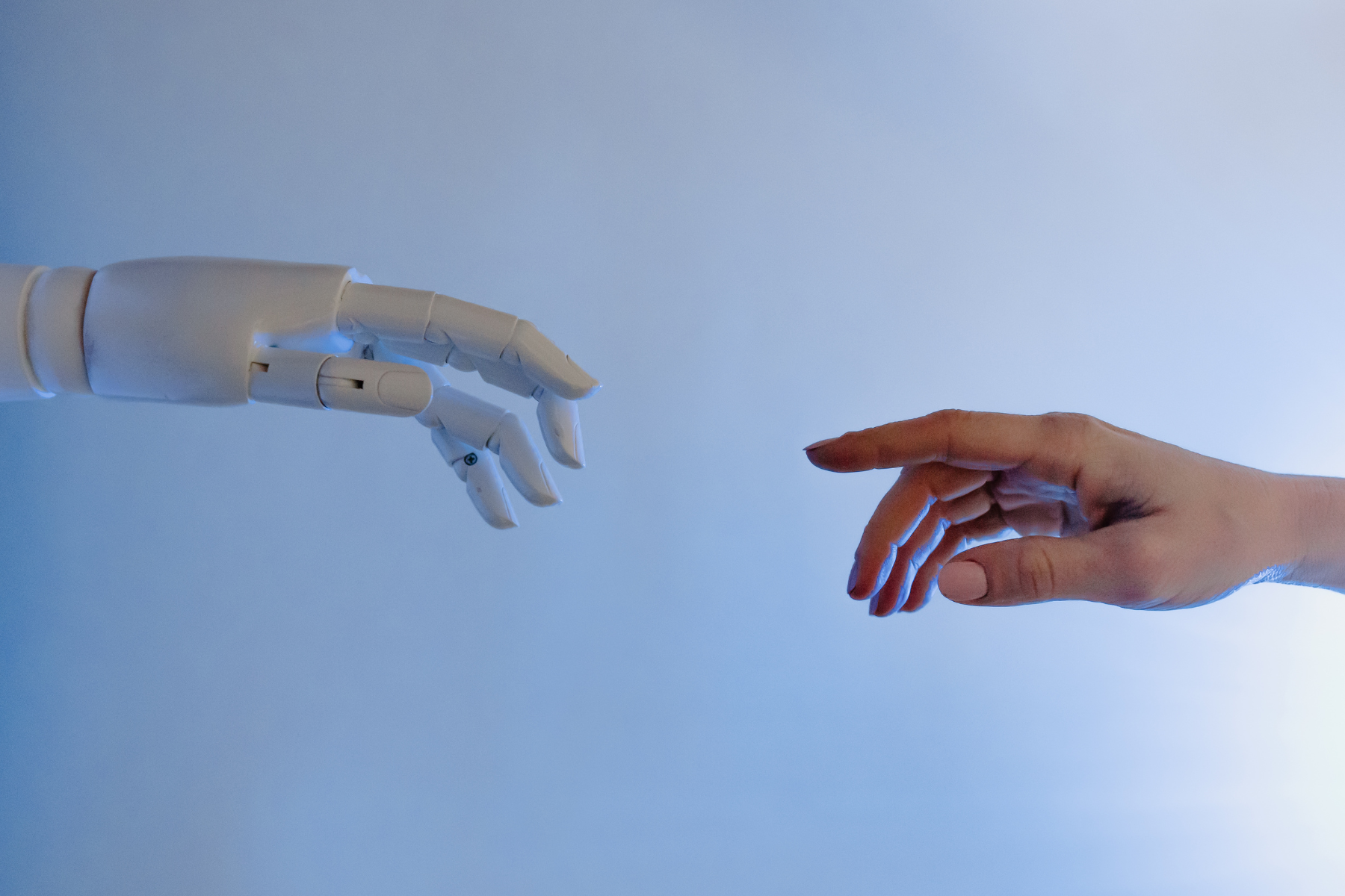 Robot and human hands touching Robot and human hands touching. AI concept