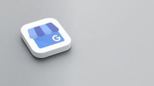 3D icon of the Google My Business logo on a gray surface.
