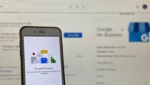 Smartphone displaying the Google My Business app page, showing connection options for local business visibility.