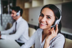 Workers using headphones at modern office.Workers using headphones at modern office.