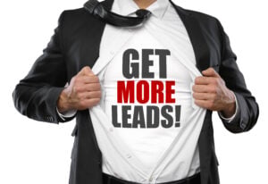 Man opening suit and revealing shirt with words: GET MORE LEADS.