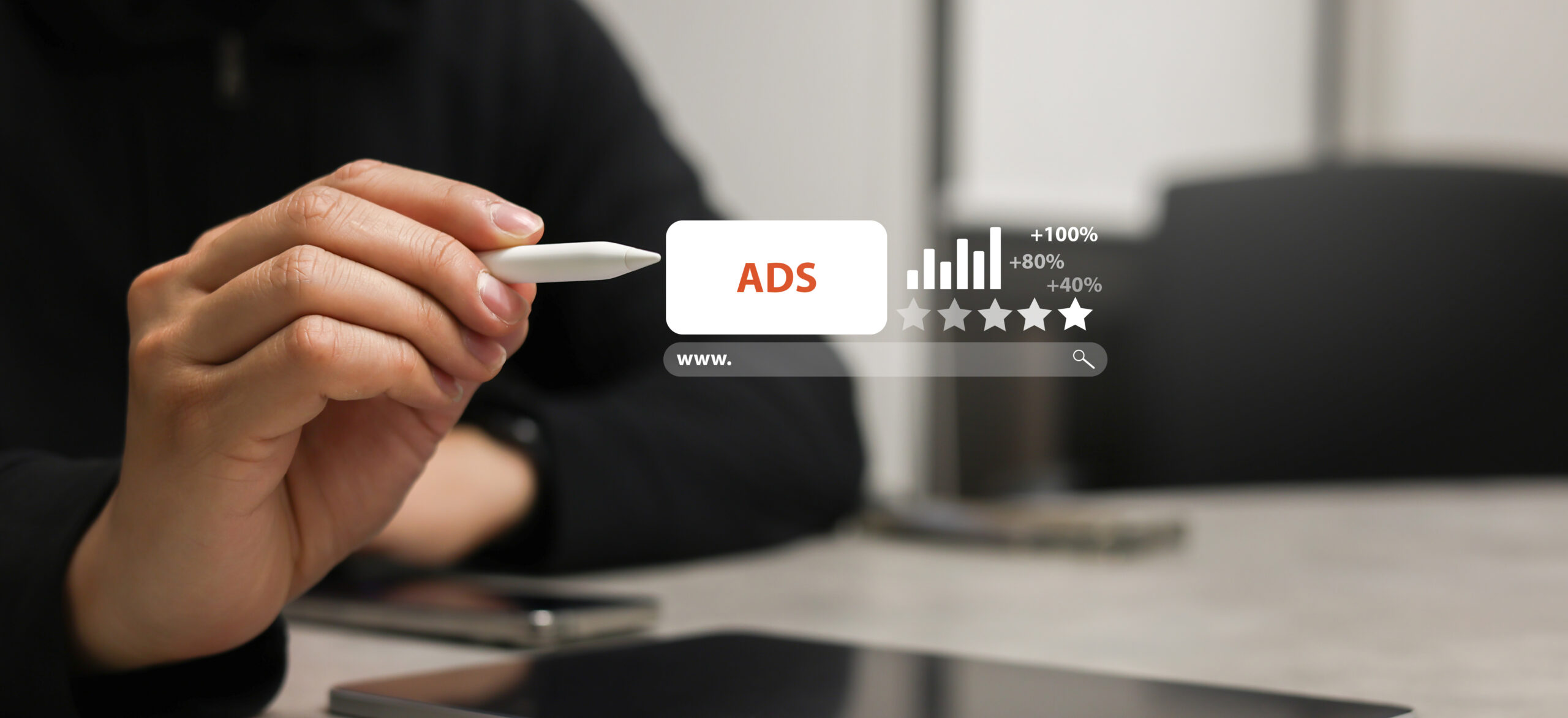 Person holding pen against icon of ADS.
