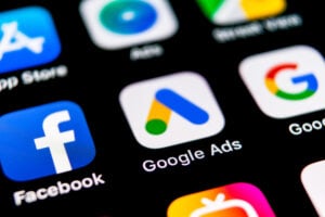 Close up of screen with apps and Google ads.