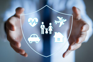 Man with protective gesture and family, life, car, travel, health and house insurance icons. Insurance concept.