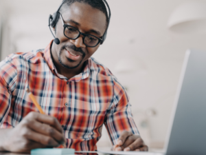 Man using headphones while on call.